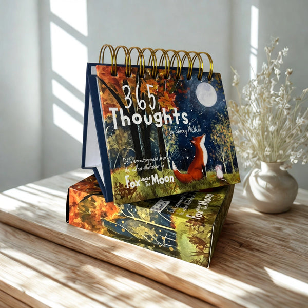 Desk calendar titled '365 Thoughts' with nature-themed design on a wooden surface.