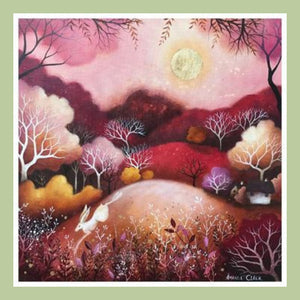 greetings card design with artwork of a hare jumping on hills with the sun in the sky and trees