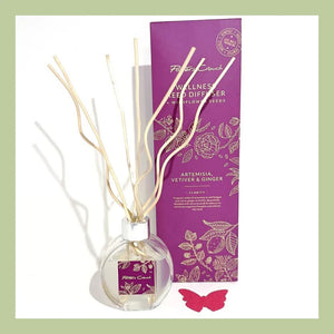reed diffuser in a glass bottle with wiggley reeds a wildflower seed butterfly card and box