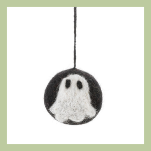 A felted black ball with a white ghost on with black string to hang