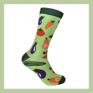 Green bamboo sock with colourful vegetable design on a white background with a green border.