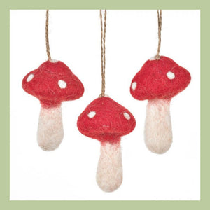 three hanging felted toadstool decorations on a white background