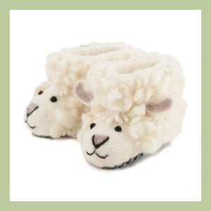 a handcrafted felt sheep keyring on a white background
