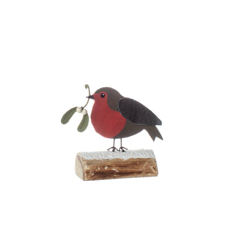 Decorative robin bird figurine with mistletoe on a white background