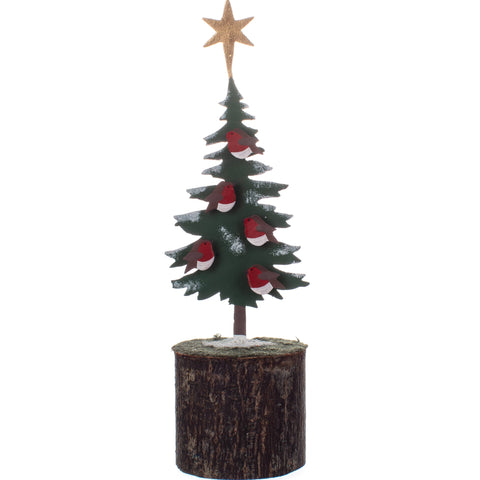 Small Christmas tree decoration with a star on top, placed on a wooden base against a white background.