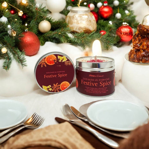 Festive Spice candles on a table with Christmas decorations