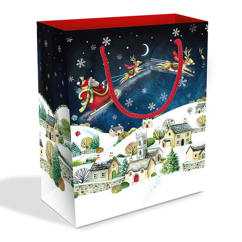 Christmas-themed gift bag with Santa Claus and reindeer design on a white background