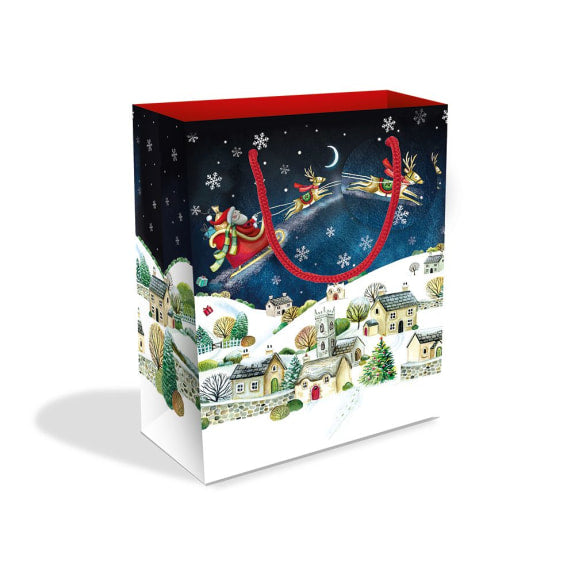 Gift bag with Santa Claus and reindeer design on a white background