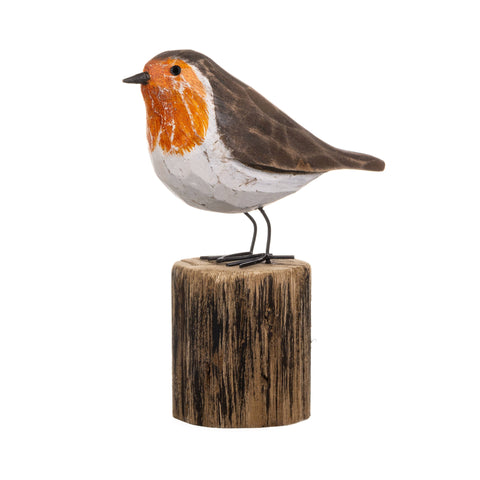 Decorative bird figurine on a wooden base against a white background