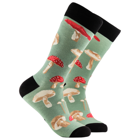 Mushroom-patterned socks on a light green background