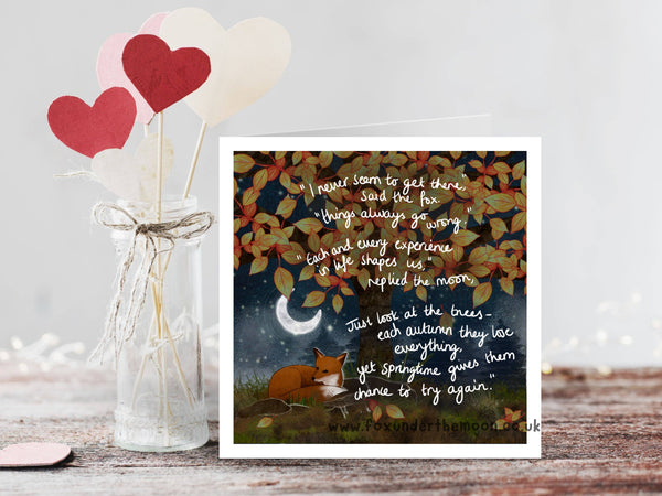 Decorative card with fox and leaves design next to heart-shaped balloons in a jar.