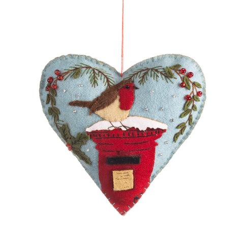 Heart-shaped Christmas ornament with a robin and postbox design on a white background