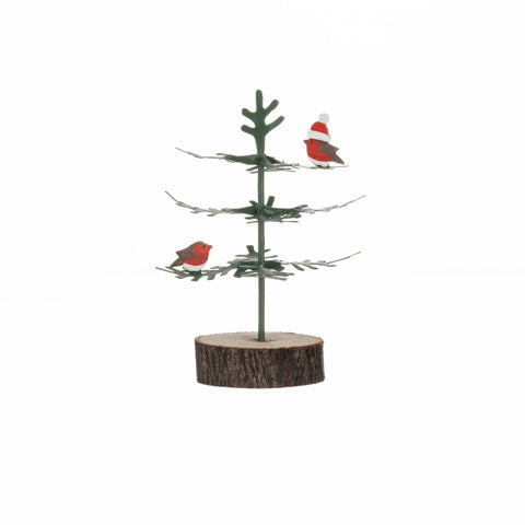 Decorative miniature Christmas tree with birds on a white background