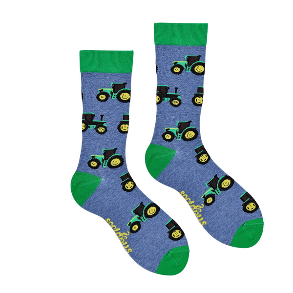Blue socks with green accents and tractor patterns on a white background