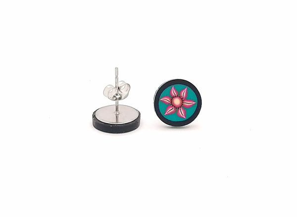 Pair of earrings with a floral design on a white background