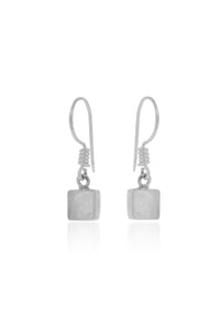 Pair of silver earrings with square pendants on a white background