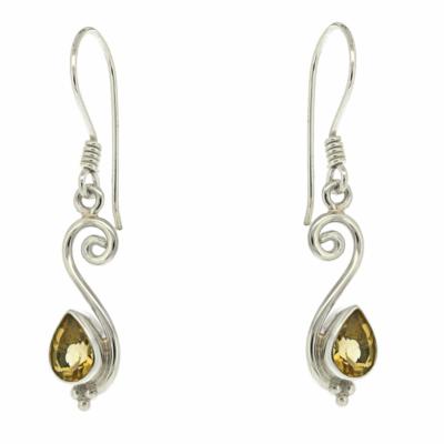 Silver earrings with teardrop-shaped gemstones on a white background