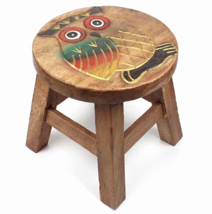 Wooden stool with an owl design on a white background