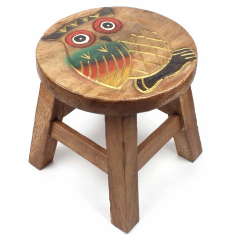 Wooden stool with an owl design on a white background