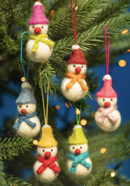 Decorative snowman ornaments with colorful hats and scarves hanging on a Christmas tree.
