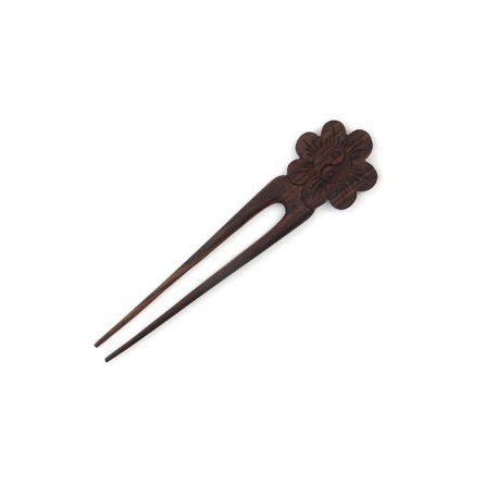 Wooden hairpin with floral design on a white background