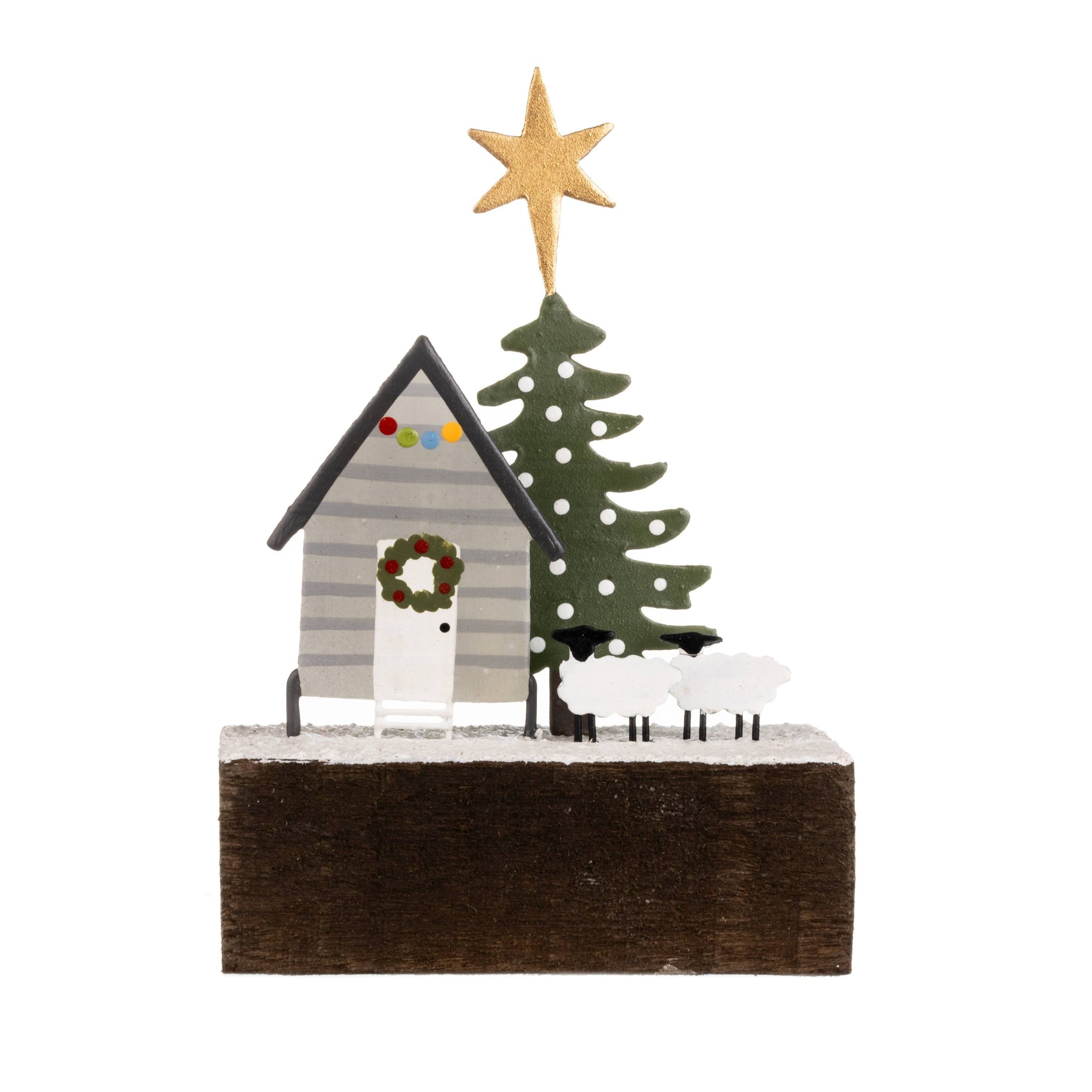 Decorative Christmas scene with a house, tree, and star on a white background