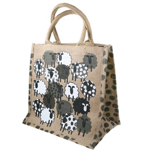 Jute bag with black and white sheep pattern on a beige background