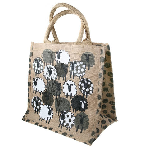 Jute bag with black and white sheep pattern on a beige background