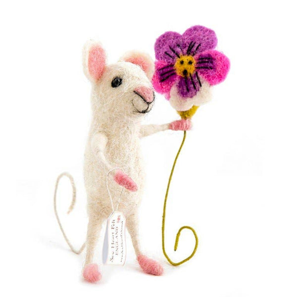 Stuffed mouse toy holding a pink flower on a white background