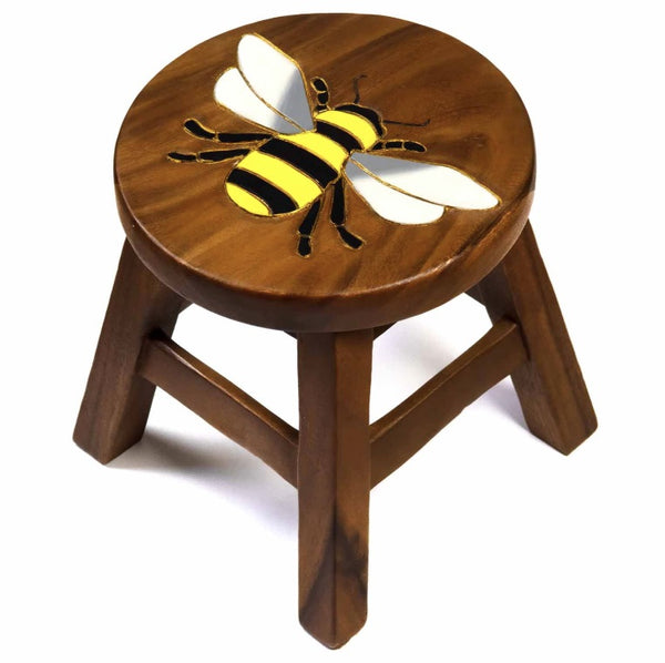 A small round wooden stool with a carved bee design on the seat, shown against a plain white background.