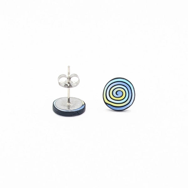 Round earrings with a spiral design on a white background