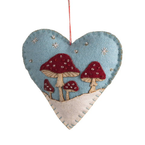 Heart-shaped ornament with mushrooms on a white background