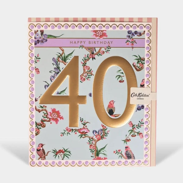 A square 40th birthday card by Cat Kidlit London, featuring a light blue floral background with pink birds and branches, a large metallic gold '40' in the center, and a pink 'HAPPY BIRTHDAY' banner at the top.