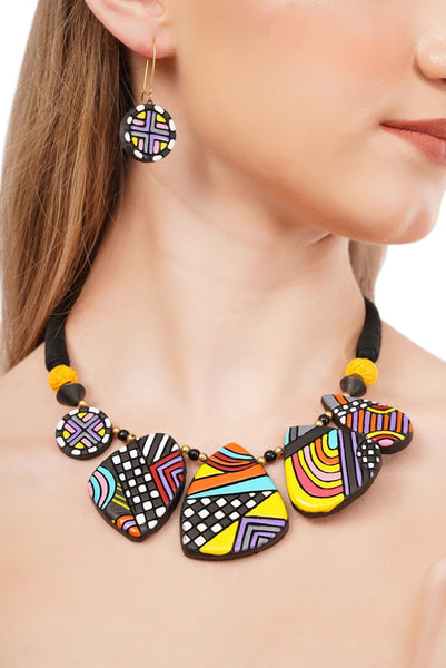 Necklace with colorful geometric pendants worn by a person