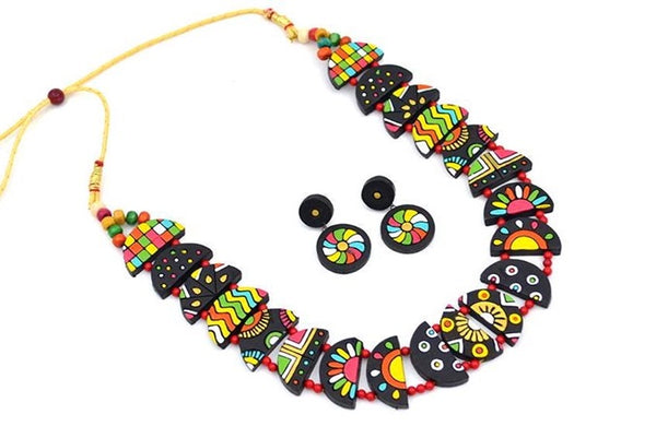 Colorful necklace and earrings set on a white background