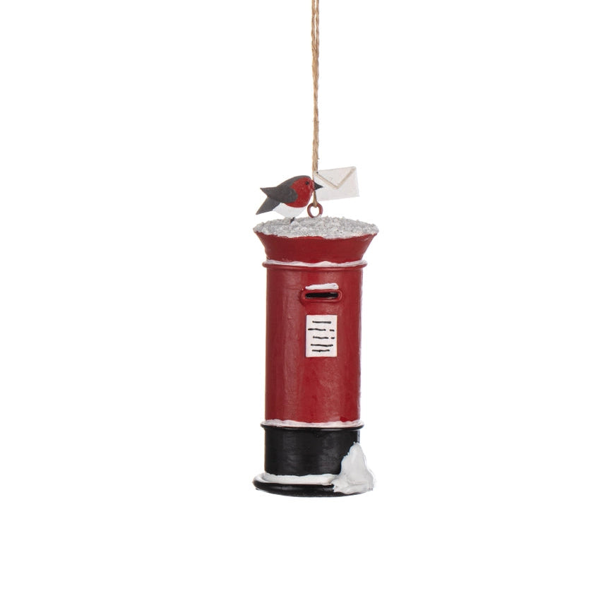 Red mailbox ornament with a bird on a white background