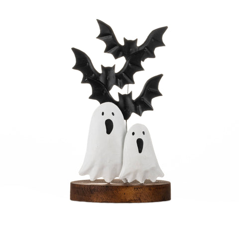 Halloween-themed decorative piece with ghosts and bats on a white background