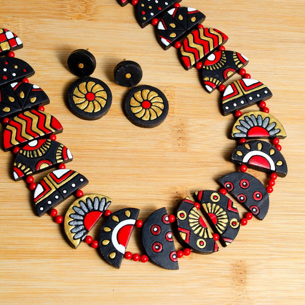 Decorative necklace with geometric patterns on a wooden surface