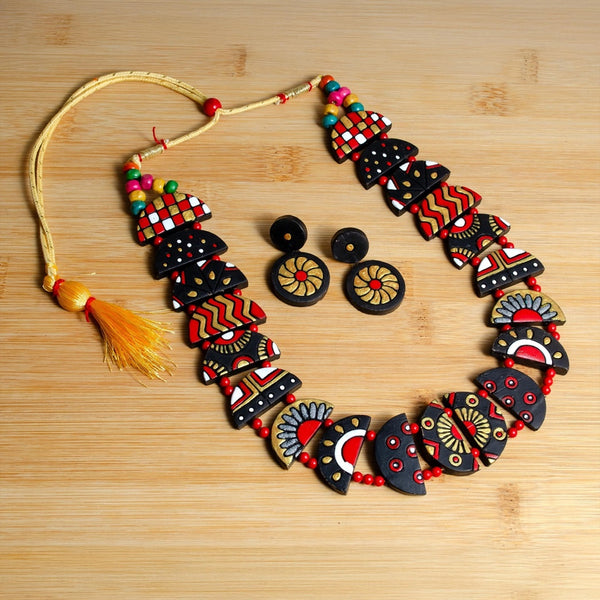 Decorative necklace with colorful patterns on a wooden surface