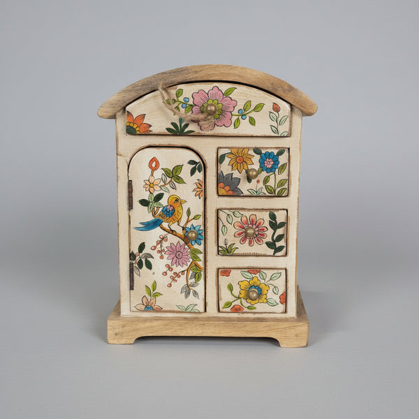 Wooden decorative box with floral and bird designs on a gray background