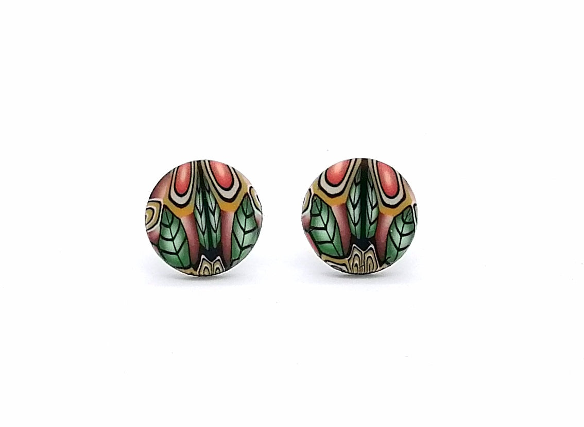 Pair of round earrings with colorful leaf pattern on a white background