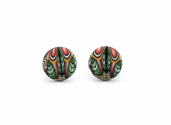 Pair of round earrings with colorful leaf pattern on a white background
