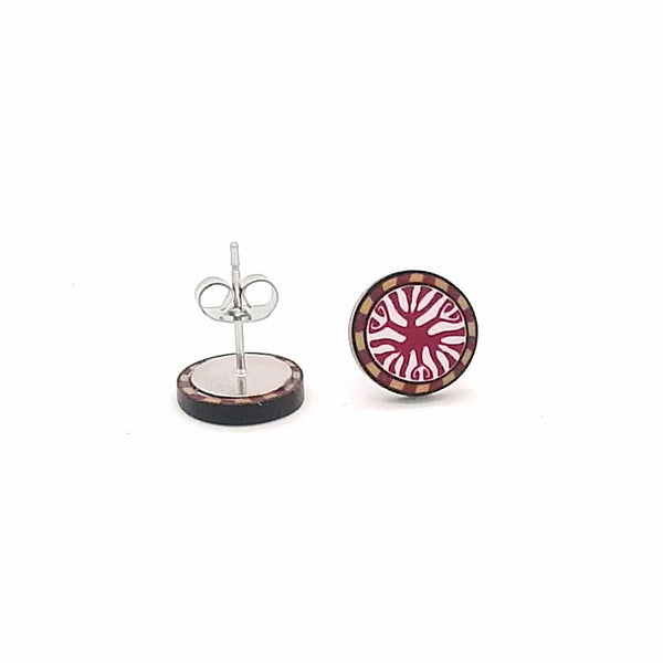 Pair of earrings with circular design on a white background
