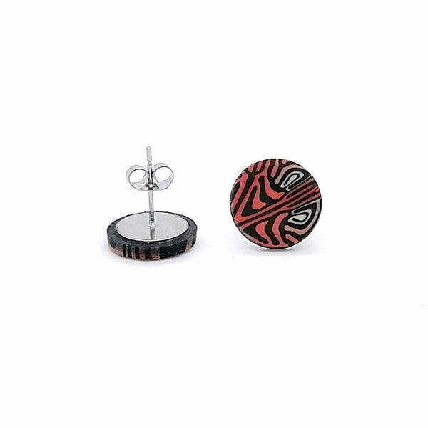 Pair of earrings with a black and red pattern on a white background