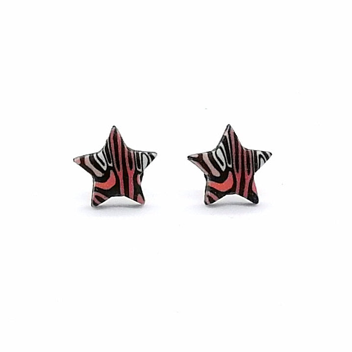 Star-shaped earrings with a red and black pattern on a white background