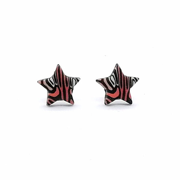 Star-shaped earrings with a red and black pattern on a white background