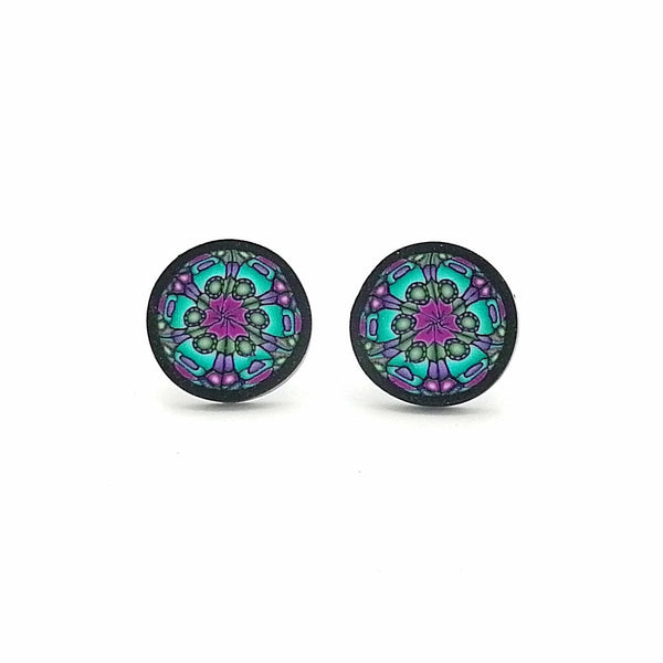 Pair of round earrings with a colorful mandala design on a white background