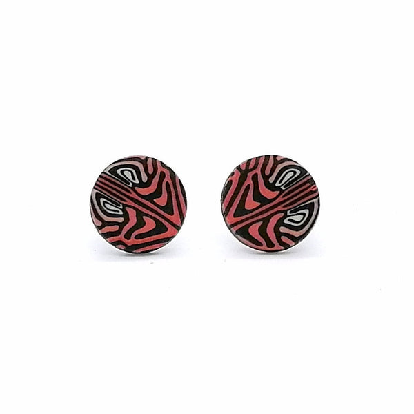 Pair of round earrings with black and red pattern on a white background