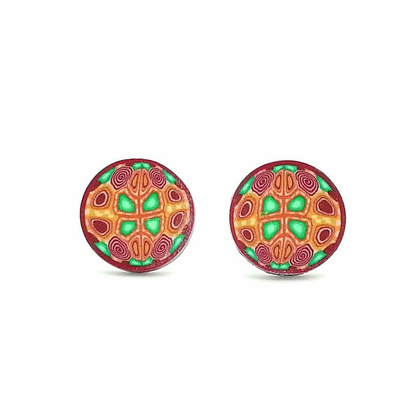 Pair of round earrings with colorful patterns on a white background