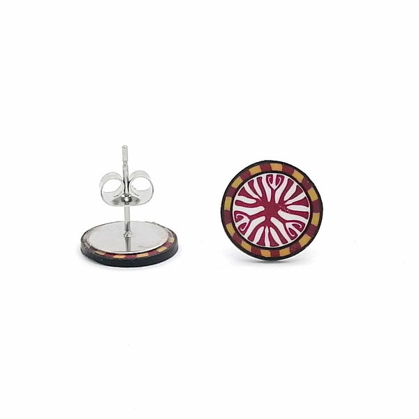 Round decorative item with a stand on a white background